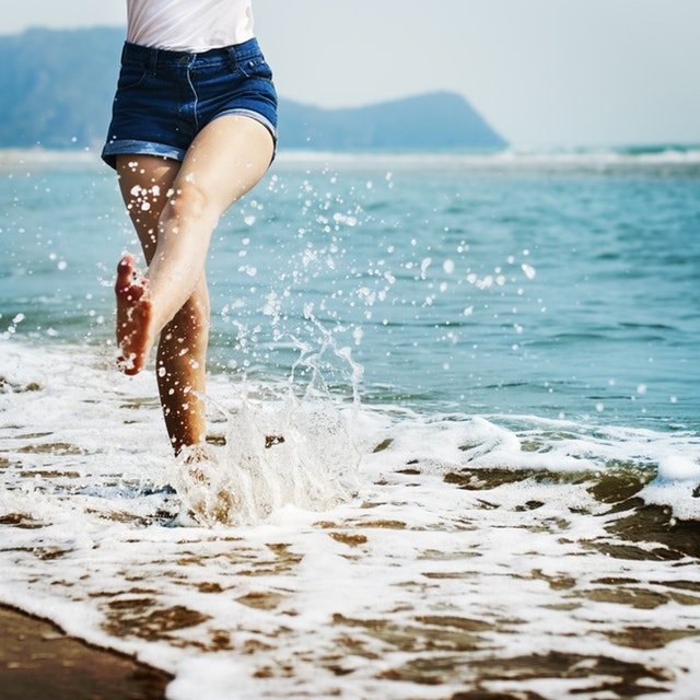 A woman playing with waves