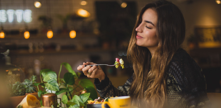 Happy woman eating