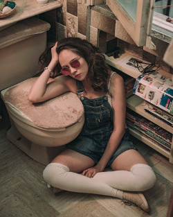 Woman beside the toilet bowl