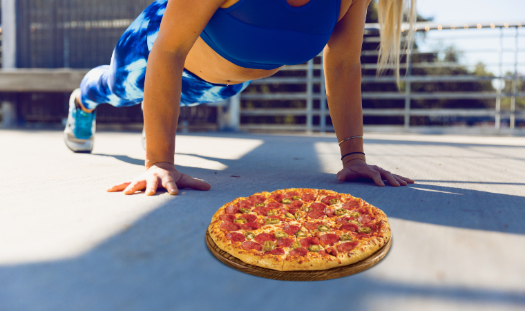 Woman doing push-ups and aiming for pizza
