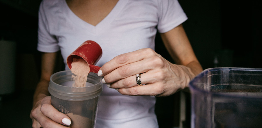 Woman preparing a diet shake