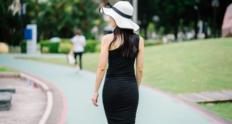 Slim woman in black outfit