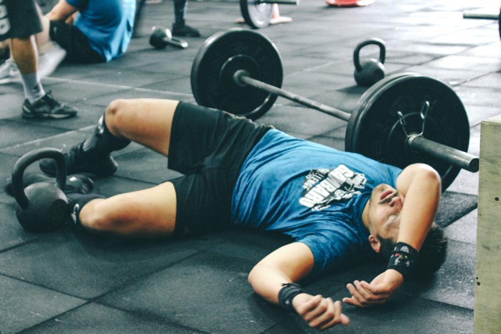 A man tired after lifting weights