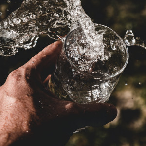 Pouring drinking water into a glass