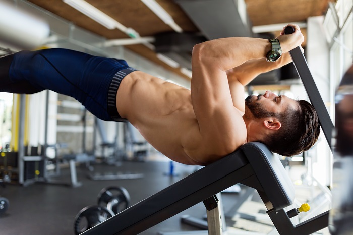 Man doing abdominal and back muscle exercises